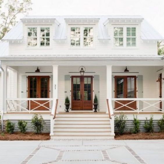 White Brick Home with a front patio 
